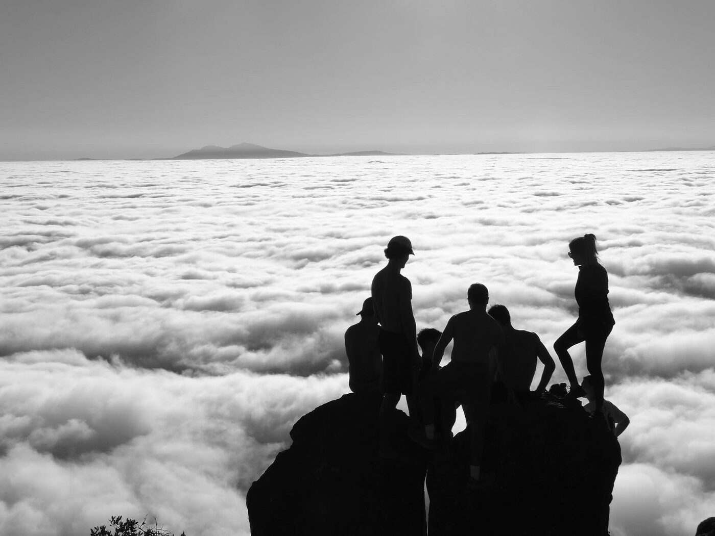 Group of friends above the clouds