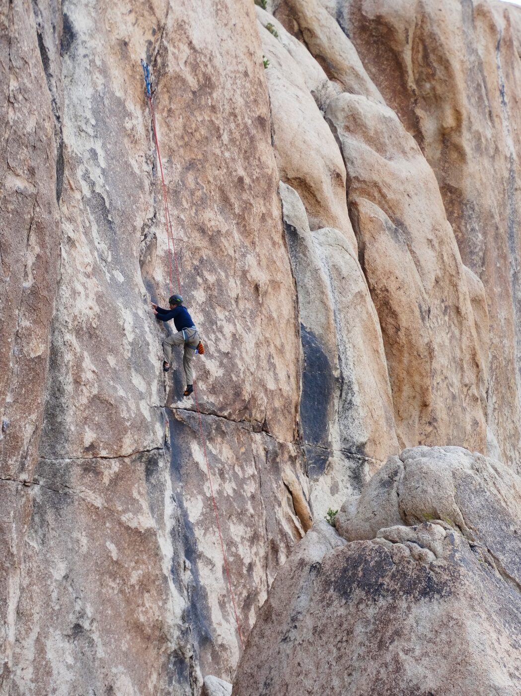 Climber on a sandstone rock face